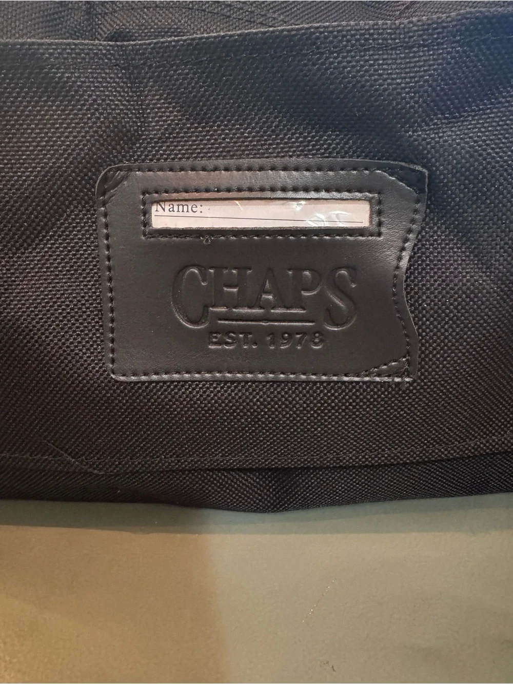Chaps Black Duffel Bag with Tan Trim shoulder strap and double handle